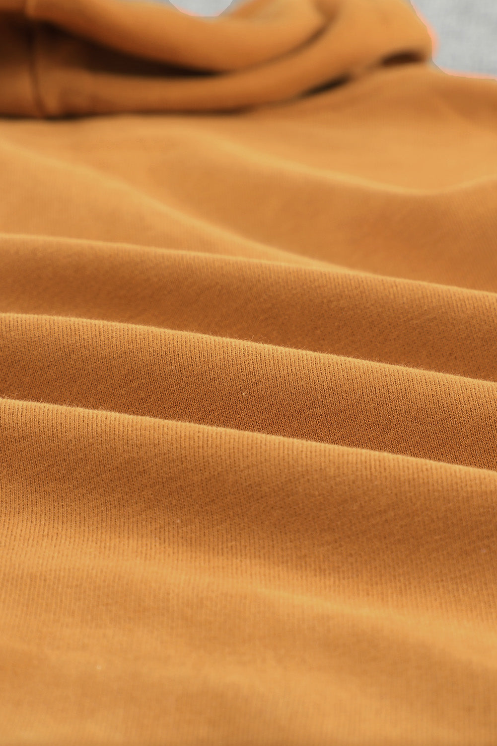 A stylish brown zip-up hoodie jacket with pockets and a drawstring hood, perfect for casual wear.