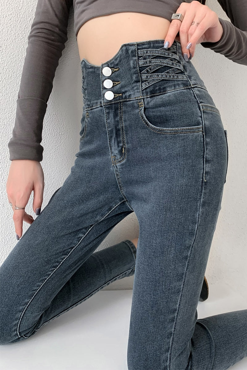 Skinny Pencil Jeans with Four Buttons, featuring a vintage high waist design and light wash finish, perfect for stylish women.