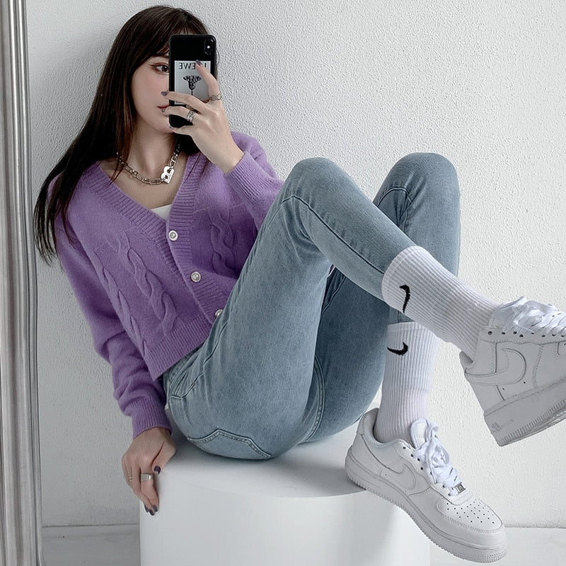 Skinny Pencil Jeans with Four Buttons, featuring a vintage high waist design and light wash finish, perfect for stylish women.