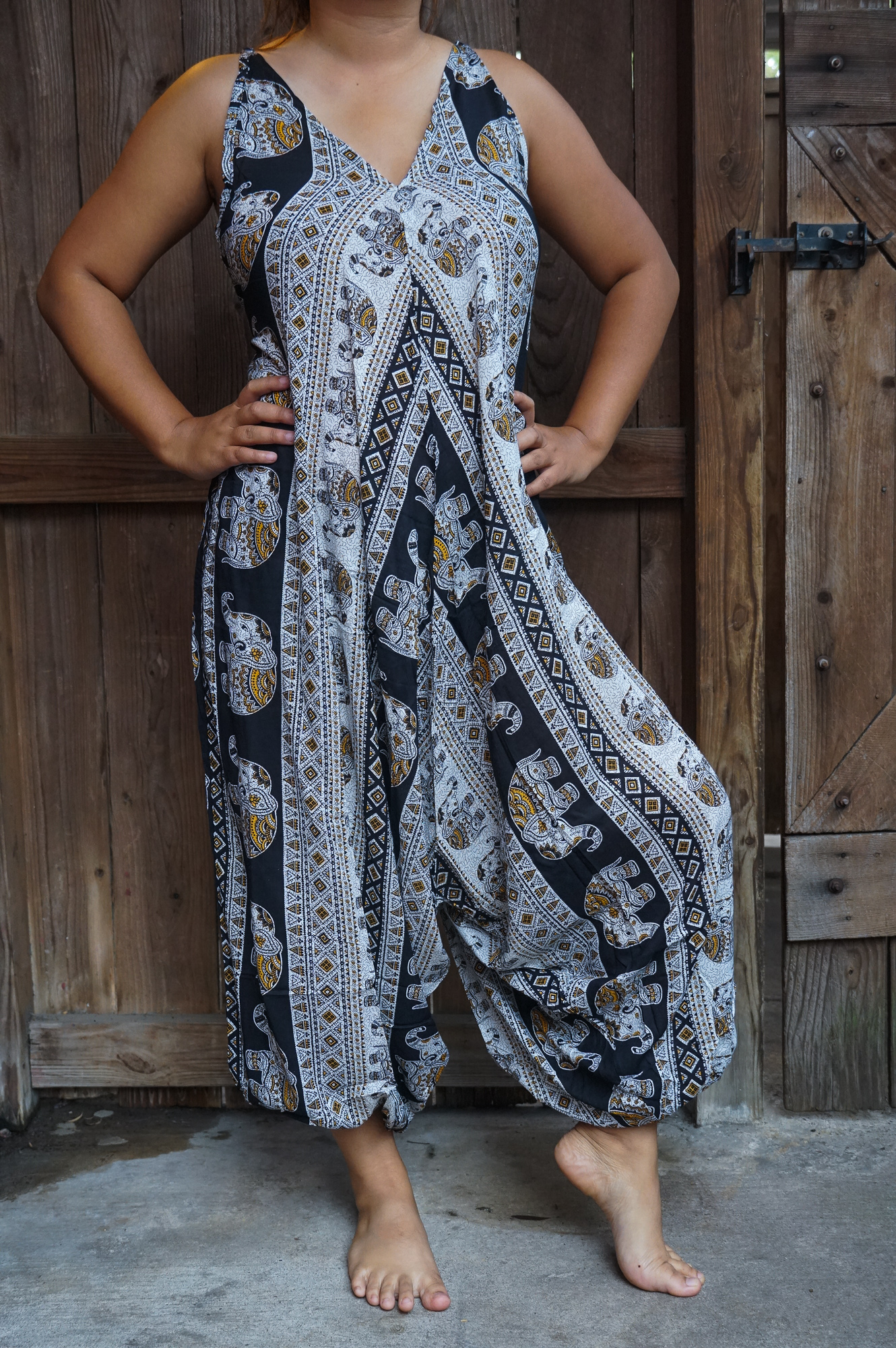 Black Elephant Boho Hippie Jumpsuit featuring wide legs, adjustable straps, and vibrant patterns, perfect for summer festivals and beach outings.