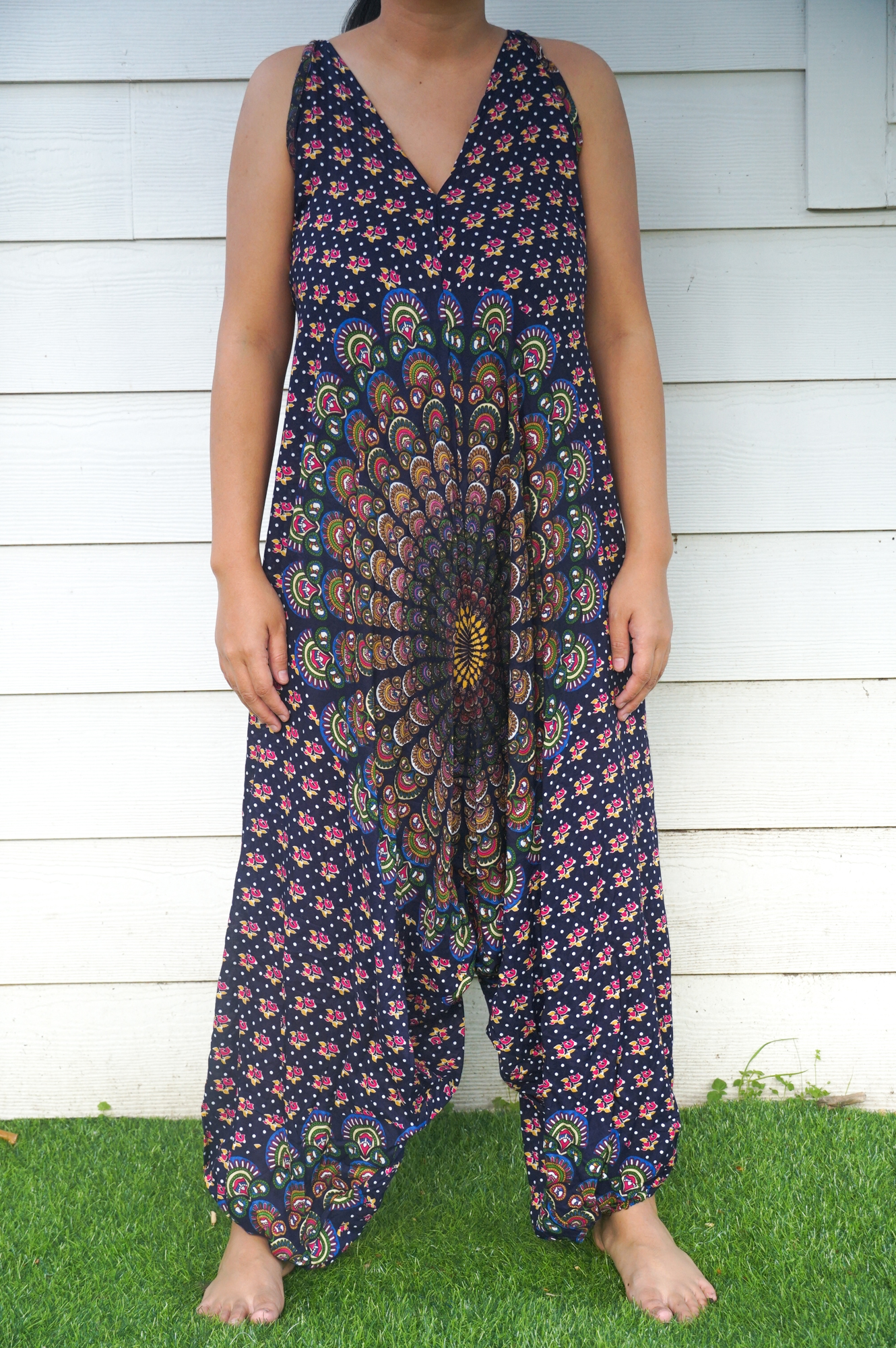 A vibrant Blue Chakra Hippie Jumpsuit featuring wide legs, adjustable straps, and a bohemian design, perfect for festivals and summer outings.
