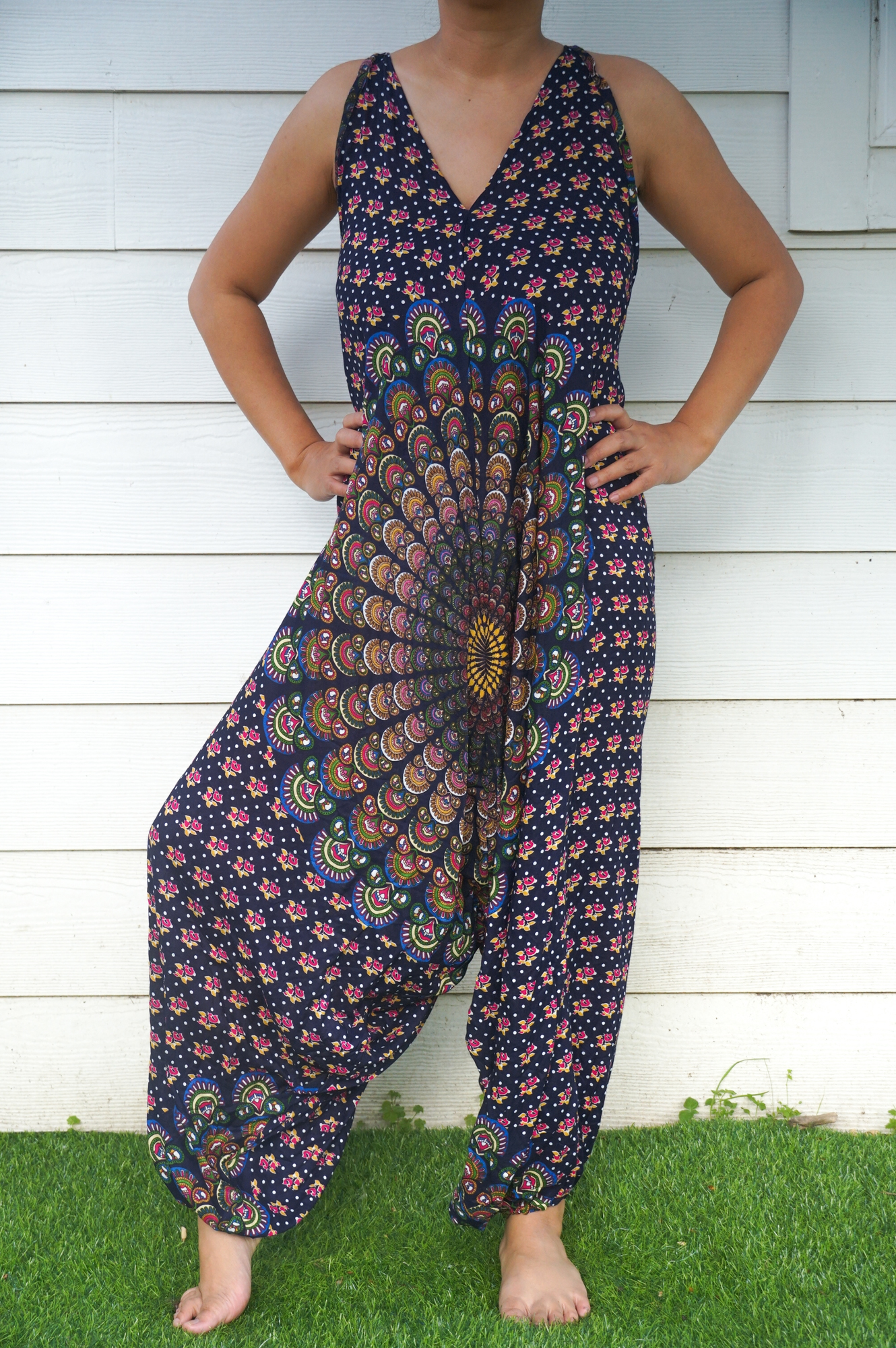 A vibrant Blue Chakra Hippie Jumpsuit featuring wide legs, adjustable straps, and a bohemian design, perfect for festivals and summer outings.