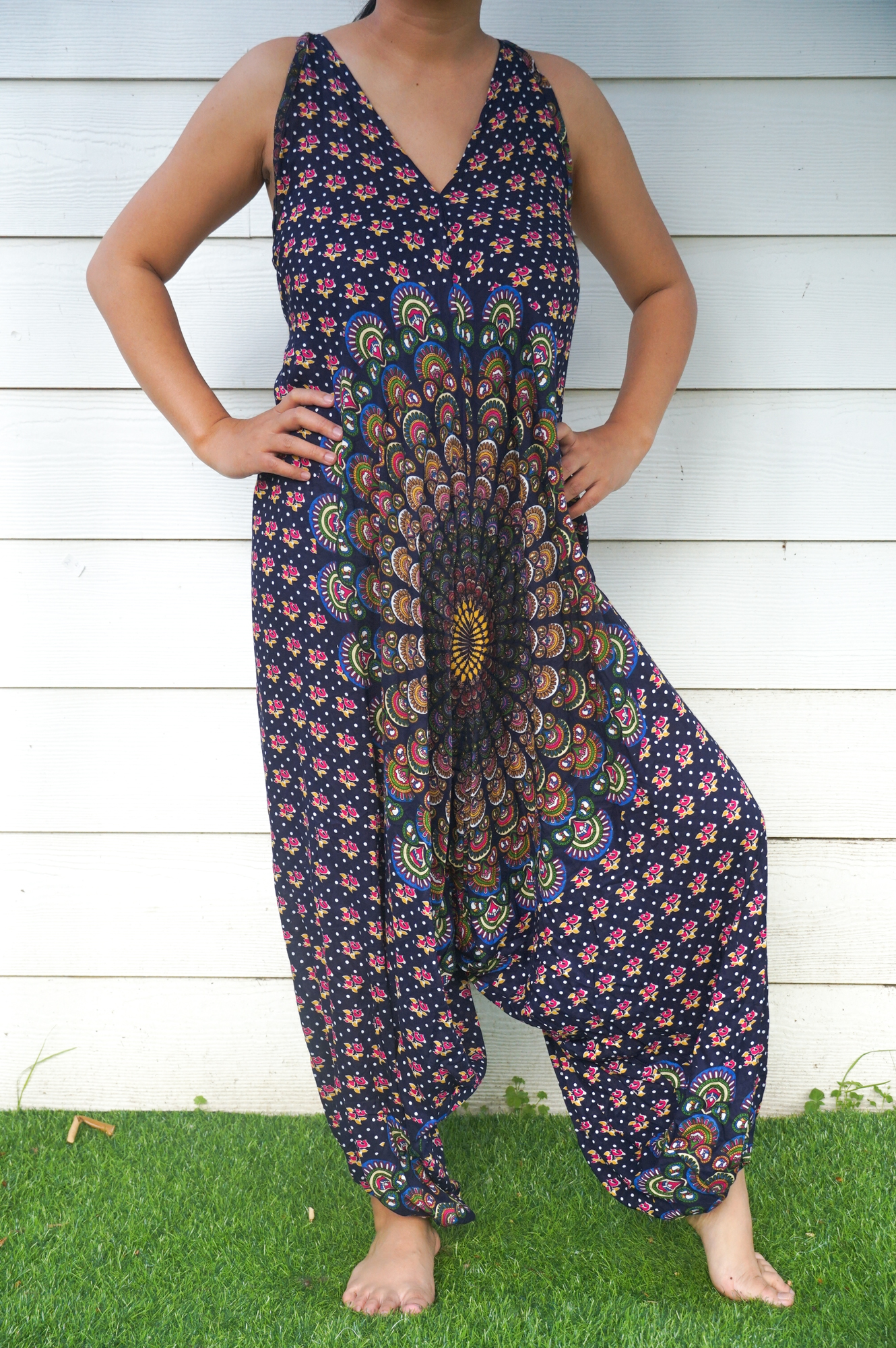 A vibrant Blue Chakra Hippie Jumpsuit featuring wide legs, adjustable straps, and a bohemian design, perfect for festivals and summer outings.