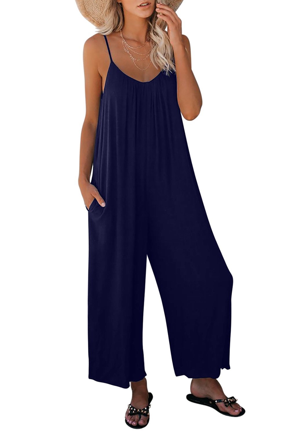 Casual dark blue spaghetti straps jumpsuit with wide legs and side pockets, perfect for summer wear.