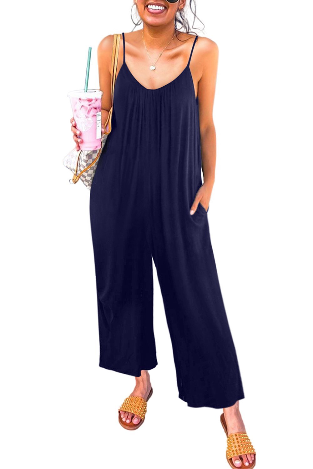 Casual dark blue spaghetti straps jumpsuit with wide legs and side pockets, perfect for summer wear.