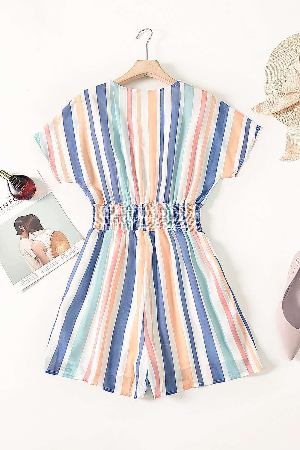 A stylish Summer Striped Print V-neck Button Romper featuring a multicolor striped pattern, short sleeves, and a buttoned front detail, perfect for summer outings.