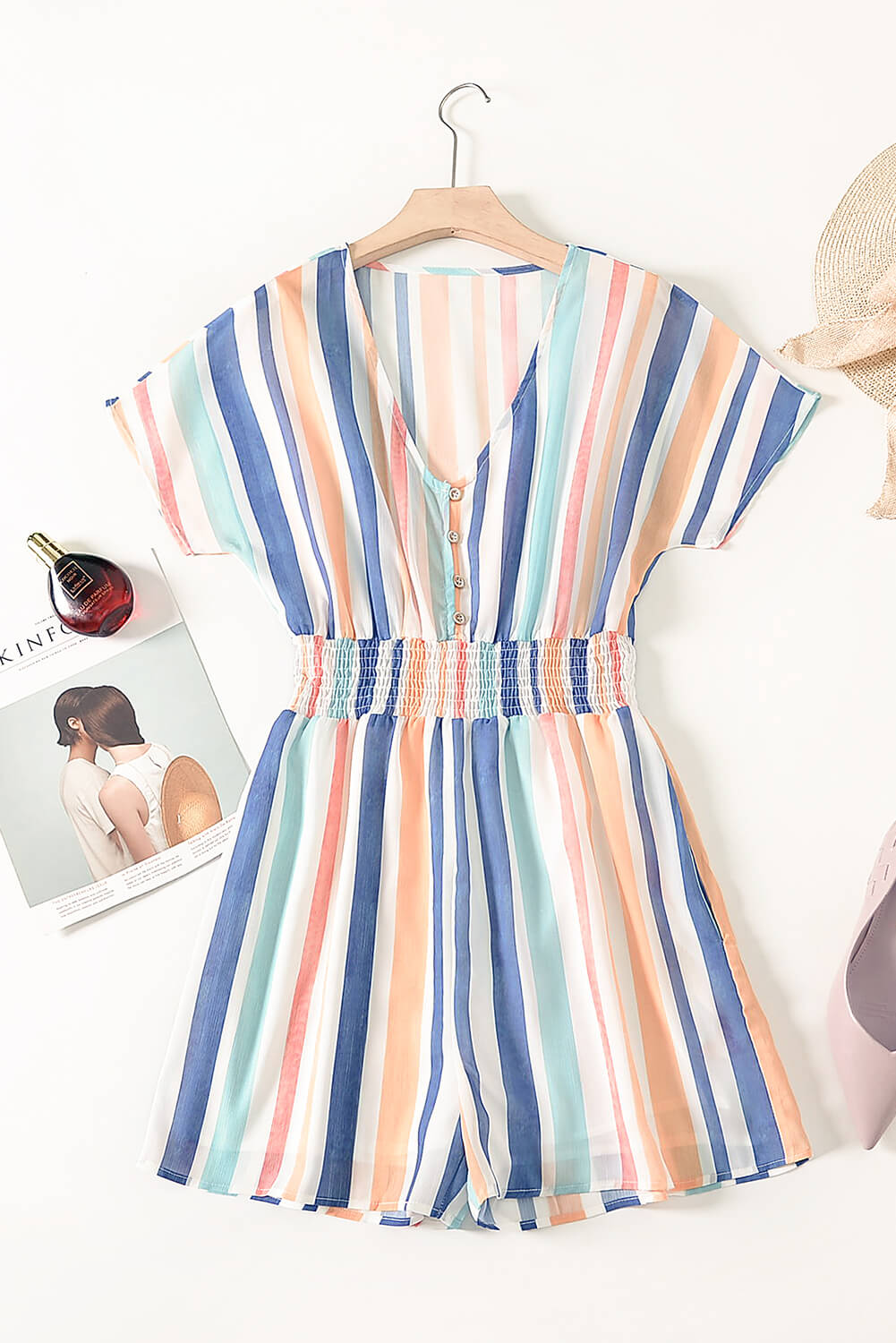 A stylish Summer Striped Print V-neck Button Romper featuring a multicolor striped pattern, short sleeves, and a buttoned front detail, perfect for summer outings.