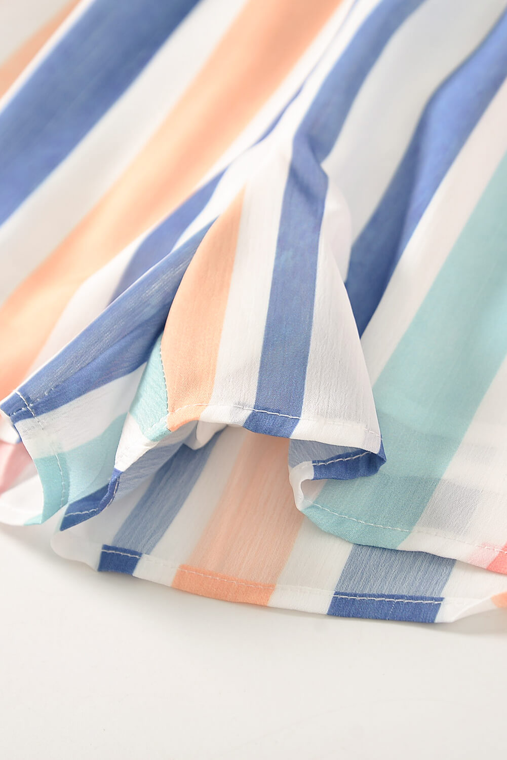 A stylish Summer Striped Print V-neck Button Romper featuring a multicolor striped pattern, short sleeves, and a buttoned front detail, perfect for summer outings.