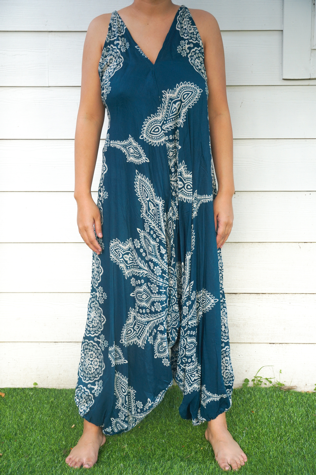 Teal Butterfly Hippie Jumpsuit featuring vibrant patterns, adjustable straps, and wide legs, perfect for summer festivals and casual outings.