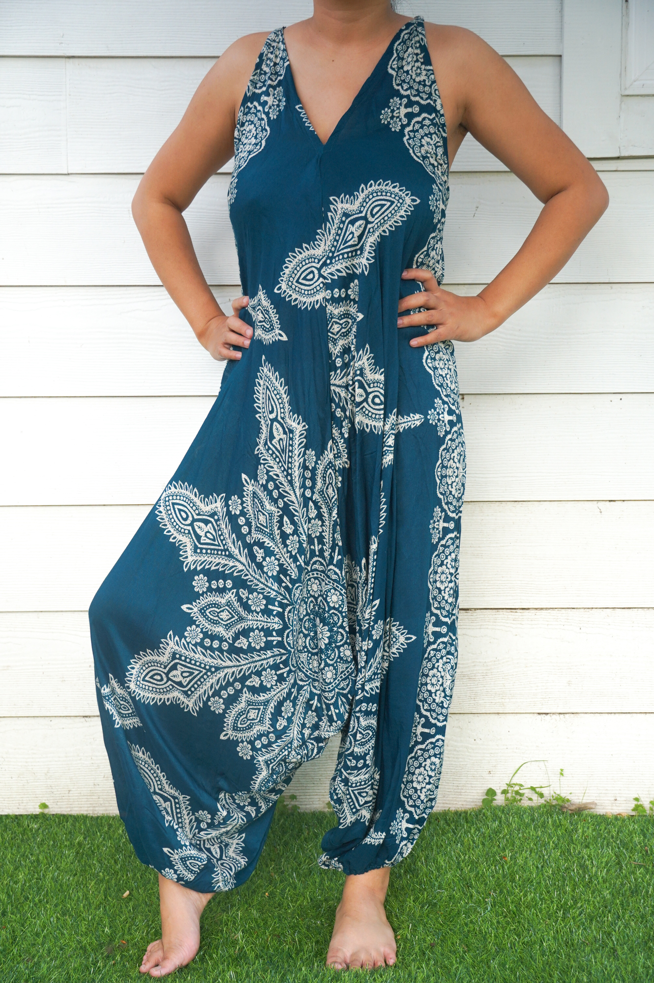 Teal Butterfly Hippie Jumpsuit featuring vibrant patterns, adjustable straps, and wide legs, perfect for summer festivals and casual outings.