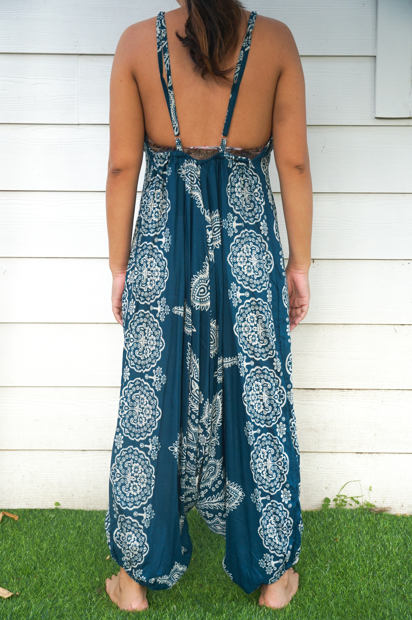 Teal Butterfly Hippie Jumpsuit featuring vibrant patterns, adjustable straps, and wide legs, perfect for summer festivals and casual outings.