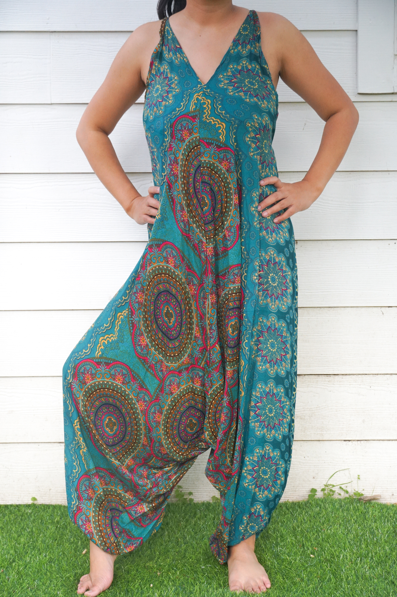 Teal Mandala Hippie Jumpsuit featuring vibrant patterns, adjustable straps, and wide legs, perfect for festivals and summer wear.