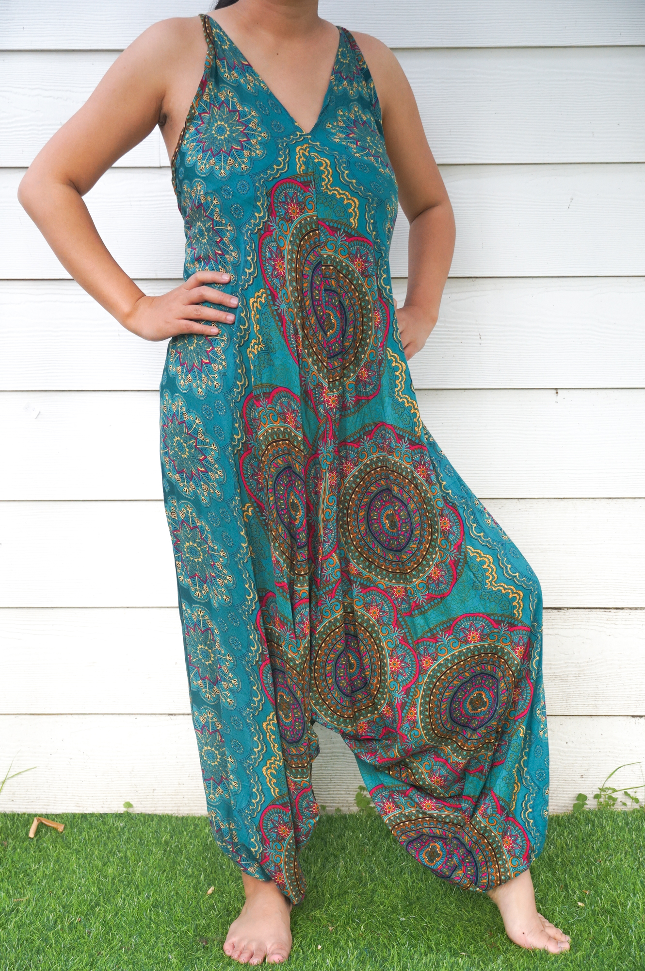 Teal Mandala Hippie Jumpsuit featuring vibrant patterns, adjustable straps, and wide legs, perfect for festivals and summer wear.