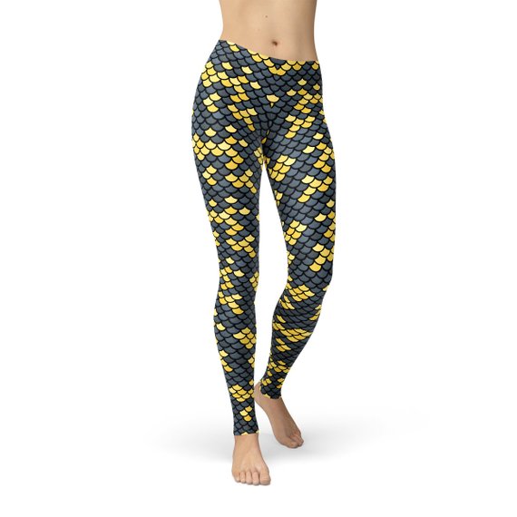 A pair of women's leggings featuring a dark gray and yellow fish scales pattern, showcasing a stylish and unique design suitable for workouts.