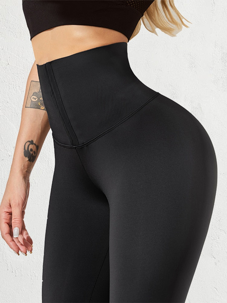 A pair of stylish women body shaper leggings in black, designed to enhance curves and provide comfort.