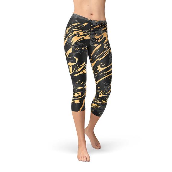 Women's Black Marble Capri Leggings with Gold Splash design, showcasing a stylish and unique pattern perfect for workouts.