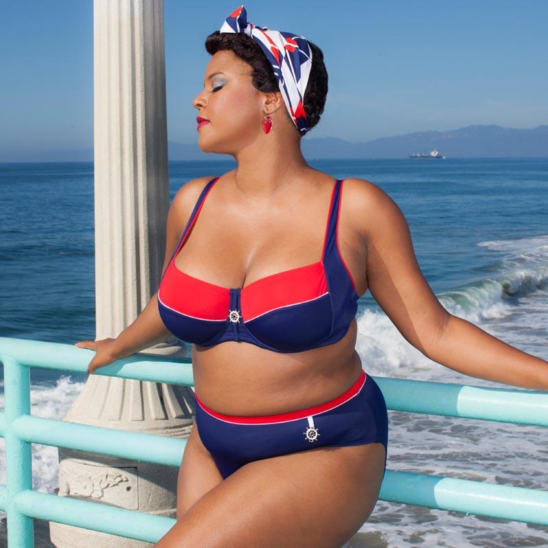 Classic Bikini Top by Lauma Swimwear in navy blue with red accents, featuring adjustable straps and a decorative charm.