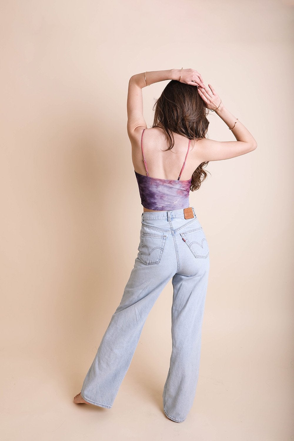 A vibrant Tie Dye Mesh Keyhole Brami featuring colorful patterns, front ties, and a stylish keyhole cutout, perfect for summer wear.