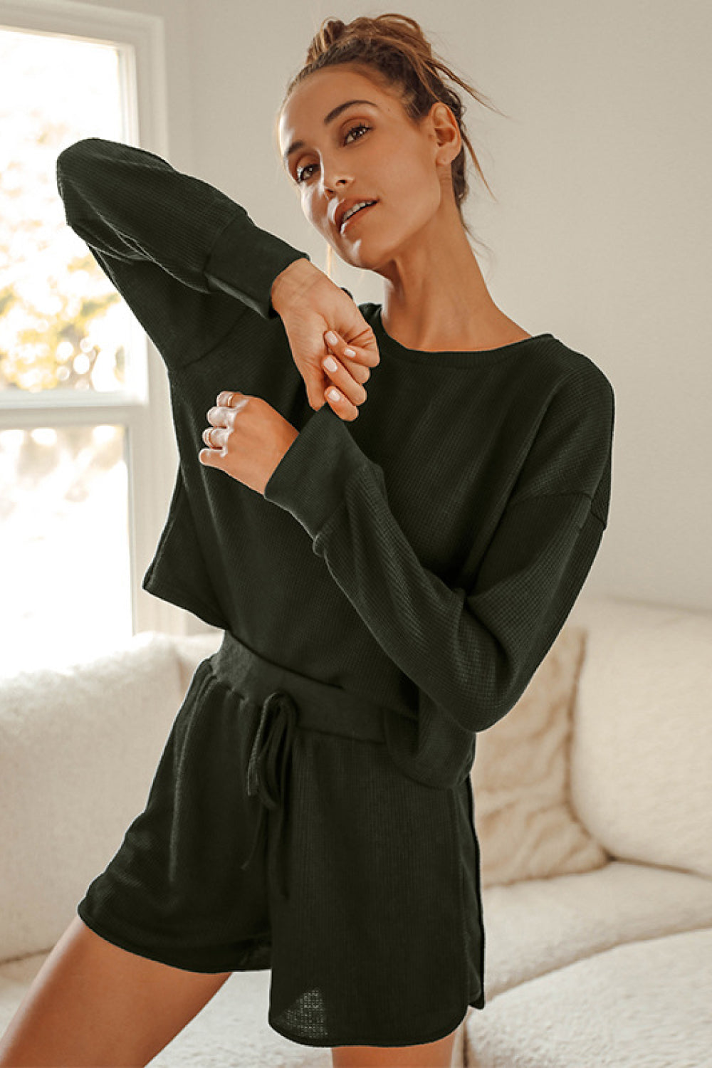 A stylish Crop Top and Shorts Lounge Set featuring a relaxed fit, long sleeves, and tie waist shorts, perfect for casual wear.