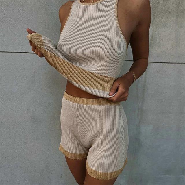 A stylish apricot knitted lounge wear two piece set for women, featuring a sleeveless top and elastic waist shorts, perfect for summer wear.