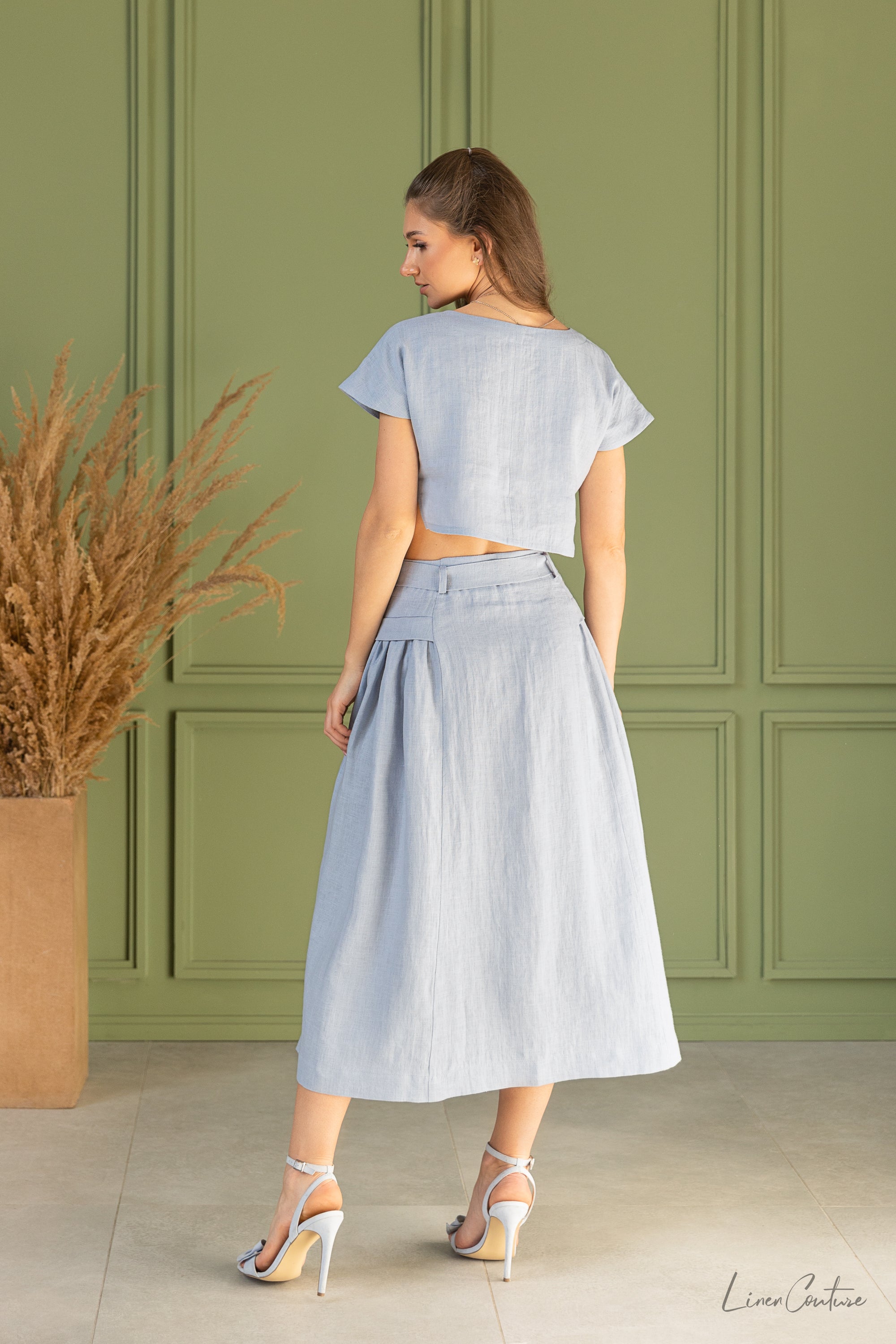 Taormina Ice Blue Linen Crop Top and Midi Skirt Set displayed on a model, showcasing its elegant design and breathable fabric.