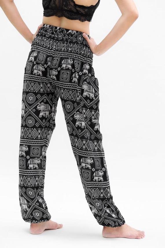 Black Elephant Boho Pants for women, made from 100% rayon, featuring an elastic waist and ankle, one side pocket, and a flowy design for comfort.