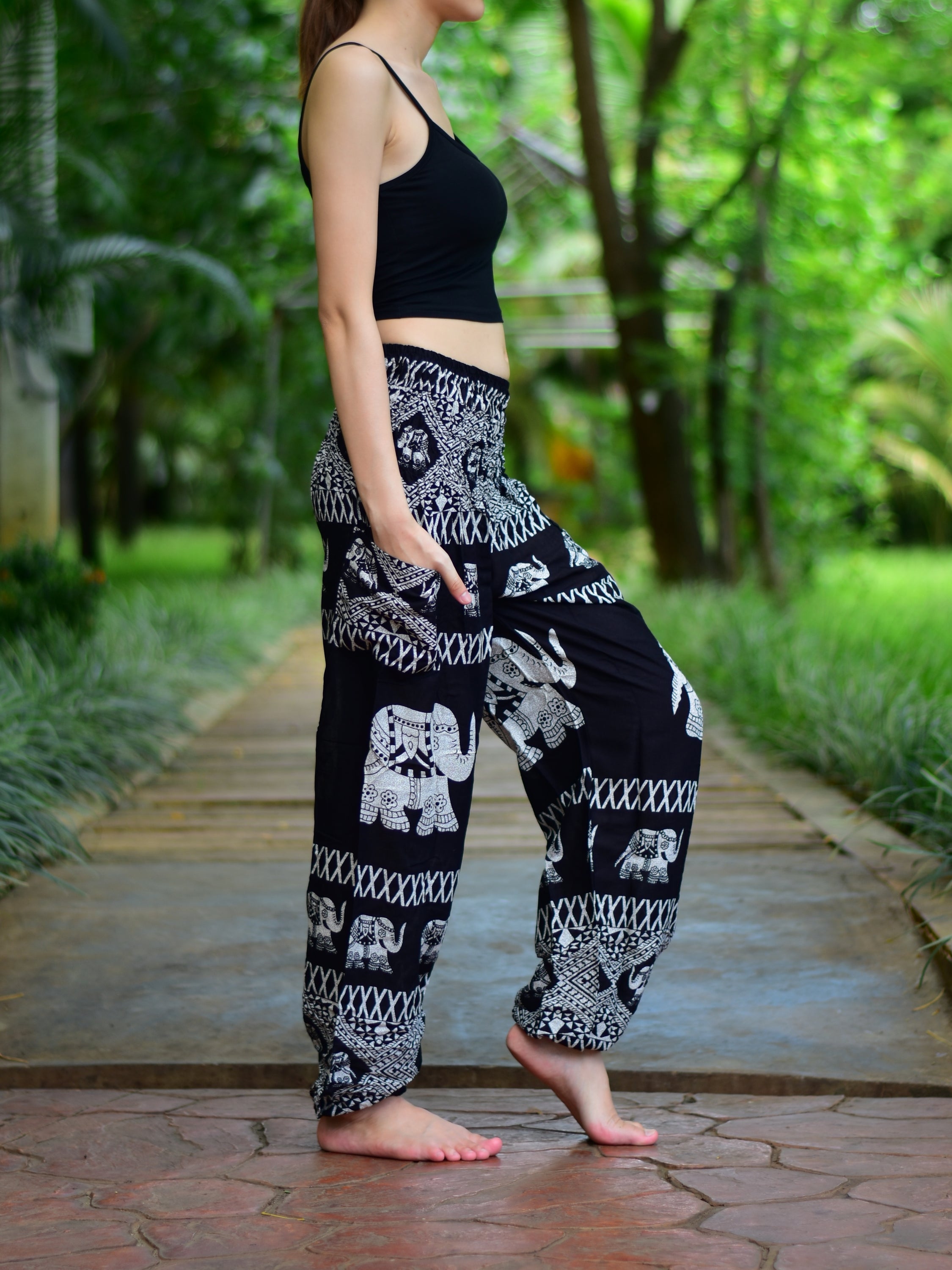 Bohotusk Black Elephant Bull Print Women's Trousers with elasticated smocked waist, showcasing vibrant colors and lightweight fabric.