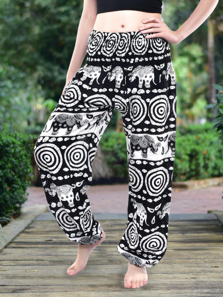 Bohotusk Black Elephant Bullseye Print trousers with elasticated smocked waist, showcasing vibrant colors and a stylish design.