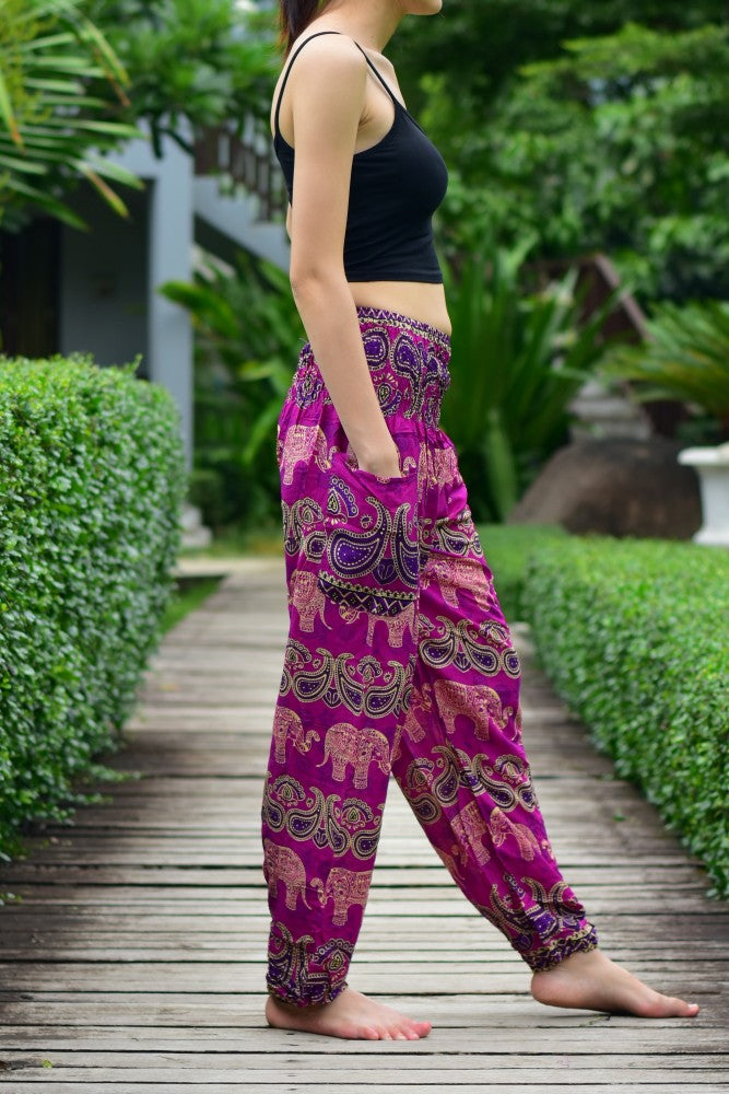 Bohotusk Kids Pink Violet Elephant Grassland Harem Trousers featuring elasticated waist and vibrant colors, perfect for kids' comfort and style.