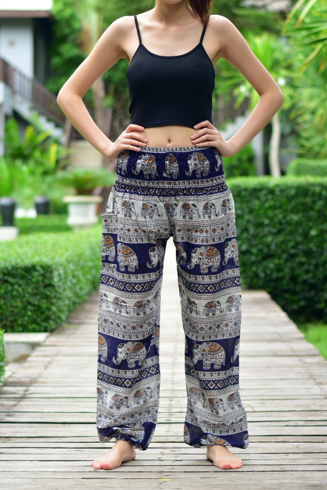 Bohotusk Navy Blue Elephant Savannah Print trousers with elasticated smocked waist, showcasing a vibrant elephant design and comfortable fit.