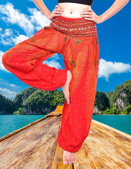 Bohotusk Orange Peacock Print Women's Harem Pants with elasticated waist and ankles, showcasing vibrant colors and a stylish design.