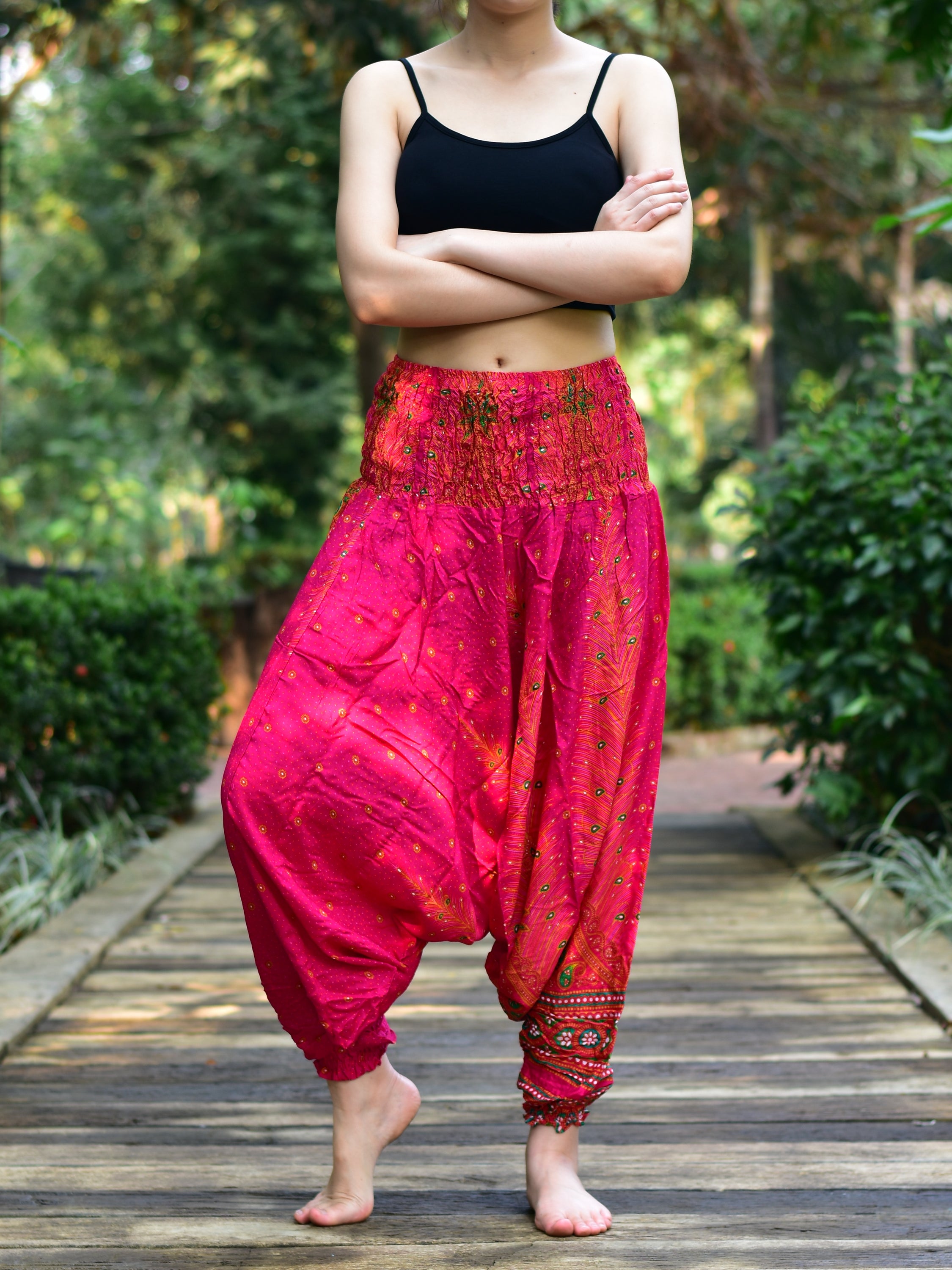 Bohotusk Pink Peacock Low Crotch Harem Pants showcasing vibrant colors and unique design, featuring a smocked waist and deep crotch for comfort.