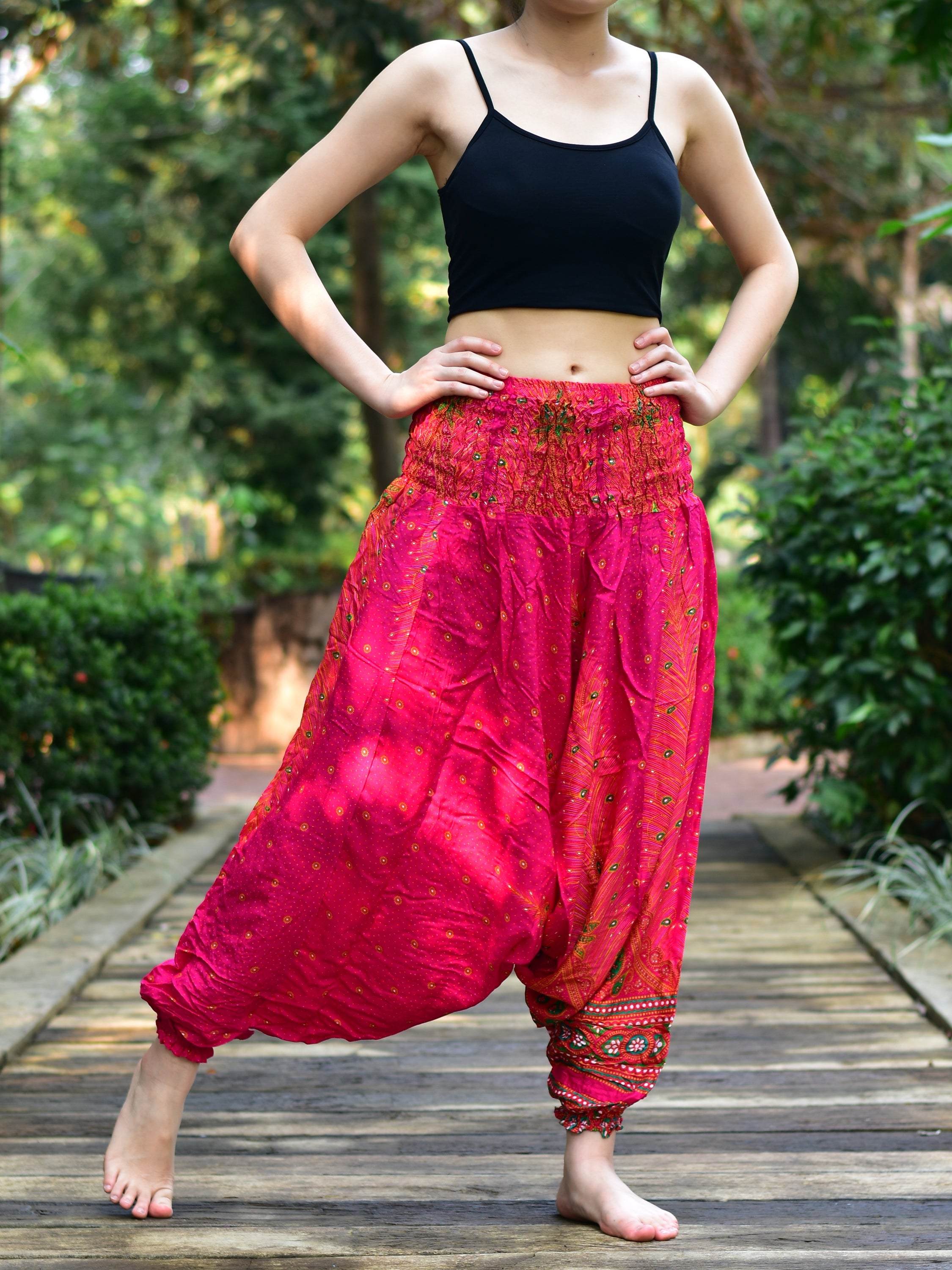 Bohotusk Pink Peacock Low Crotch Harem Pants showcasing vibrant colors and unique design, featuring a smocked waist and deep crotch for comfort.