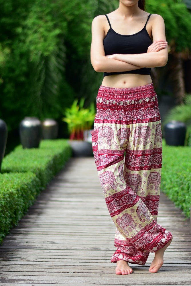 Bohotusk Red Elephant Herd Print Women's Trousers with elasticated smocked waist, showcasing vibrant colors and unique design.