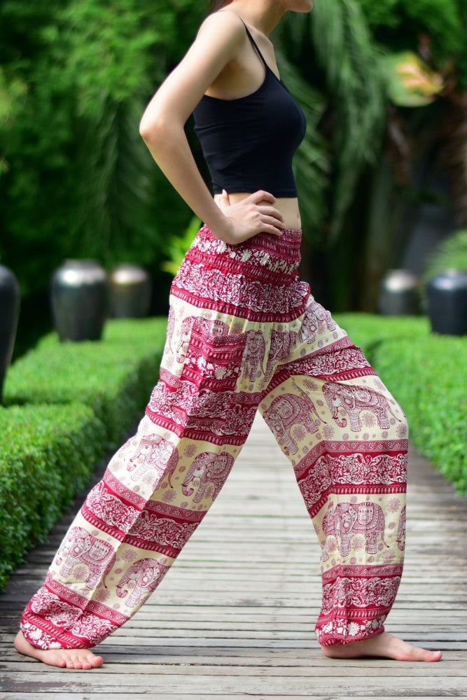Bohotusk Red Elephant Herd Print Women's Trousers with elasticated smocked waist, showcasing vibrant colors and unique design.