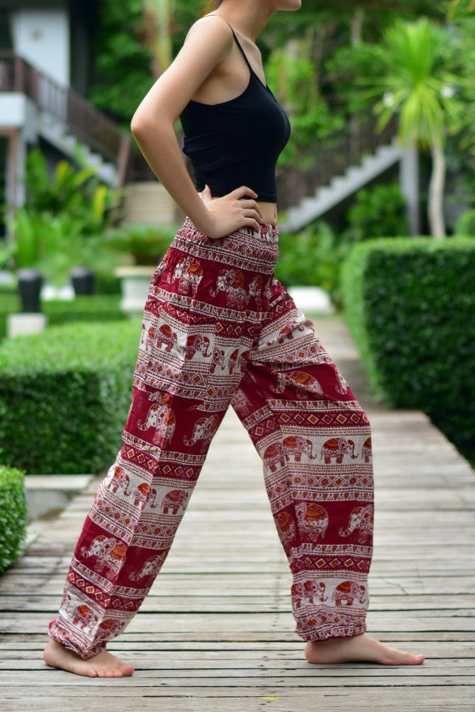Bohotusk Red Elephant Savannah Print trousers with elasticated smocked waist, showcasing vibrant colors and comfortable design.
