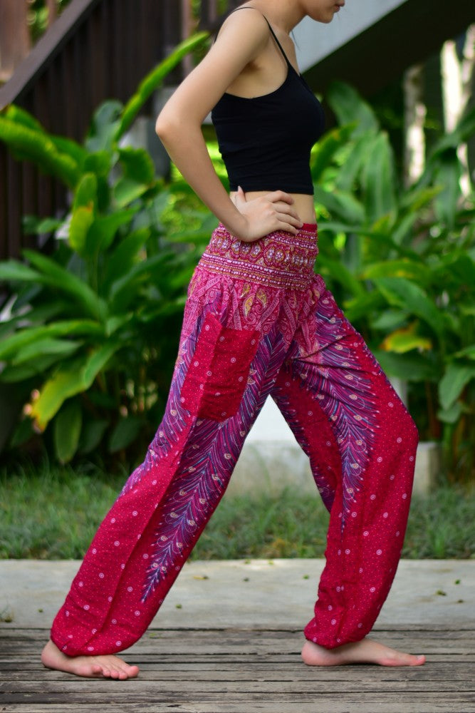 Bohotusk Red Peacock Print Women's Harem Pants with elasticated waist and ankle, showcasing vibrant colors and a stylish design.