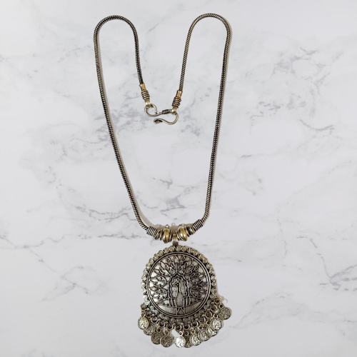 Bohotusk Shiva Oxidised Silver Shield Pendant with intricate coin details, showcasing its unique design and craftsmanship.