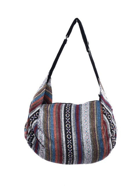 Bohotusk Striped Multi Coloured Cotton Canvas Duffle Bag with adjustable straps and zip pocket, showcasing vibrant colors and spacious design.