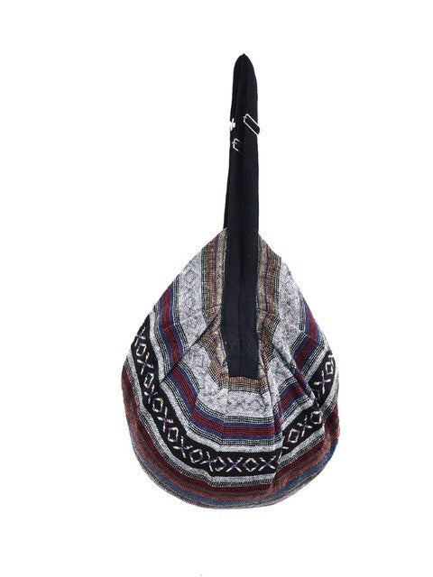 Bohotusk Striped Multi Coloured Cotton Canvas Duffle Bag with adjustable straps and zip pocket, showcasing vibrant colors and spacious design.