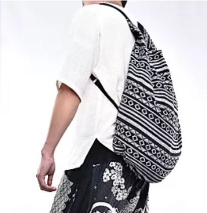 Bohotusk Striped Multi Coloured Cotton Canvas Duffle Bag with adjustable straps and zip pocket, showcasing vibrant colors and spacious design.