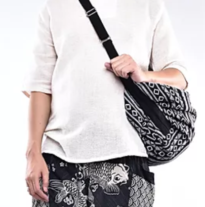 Bohotusk Striped Multi Coloured Cotton Canvas Duffle Bag with adjustable straps and zip pocket, showcasing vibrant colors and spacious design.