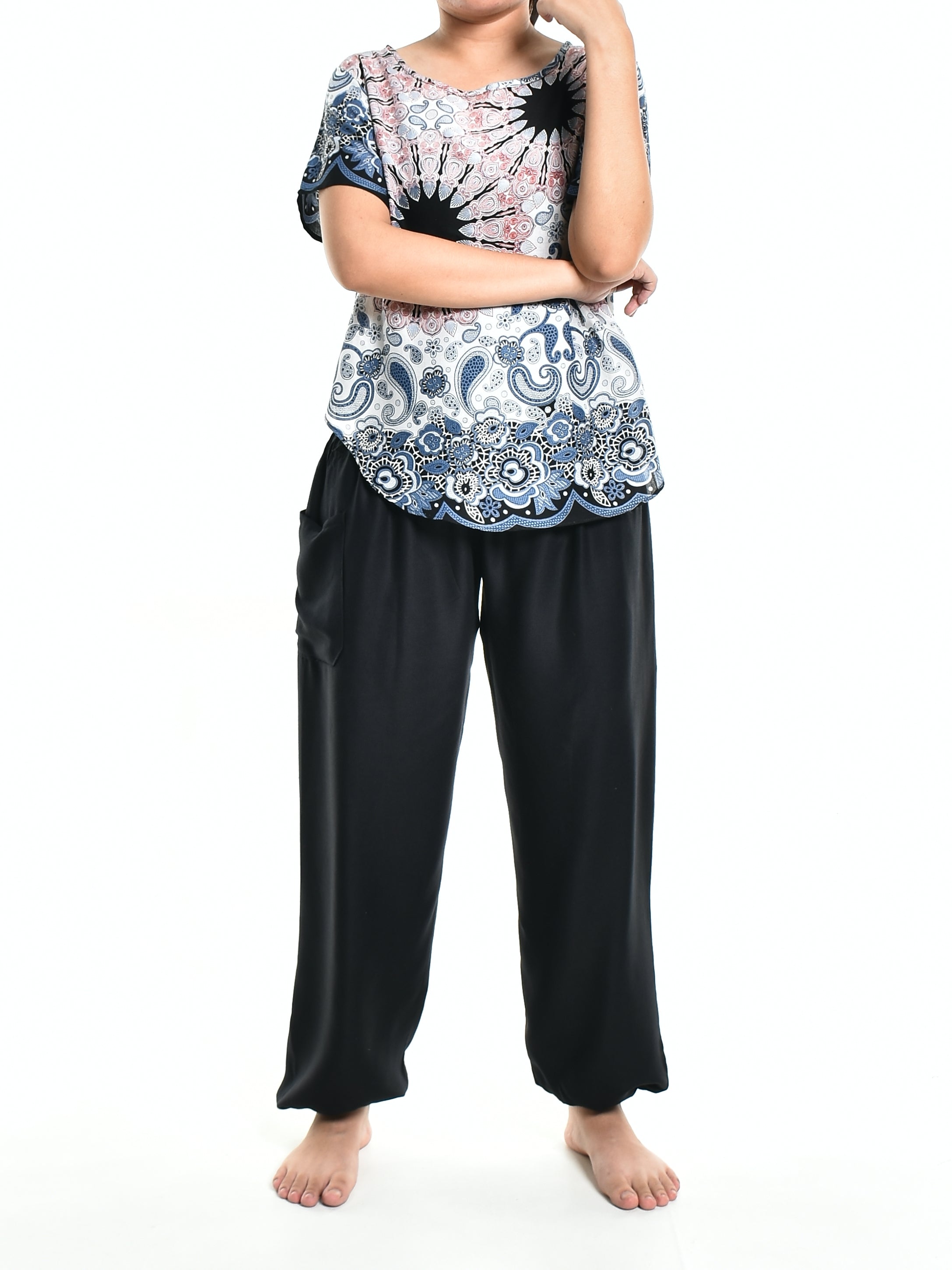 Bohotusk White Pink Teardrop Splash Print Short Sleeved Top displayed on a mannequin, showcasing its vibrant colors and stylish design.