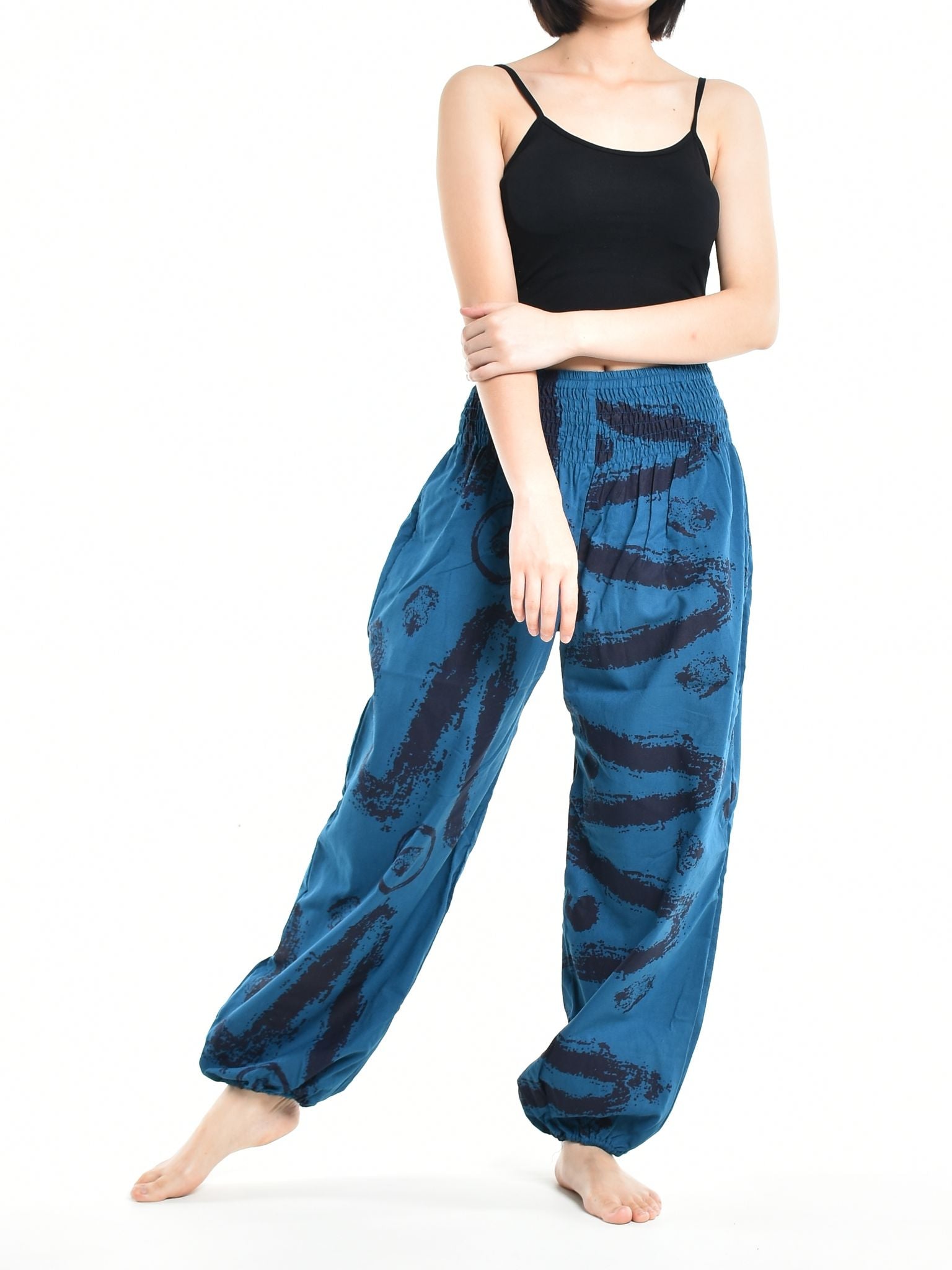 Bohotusk Women's Autumn Blue Swirl Cotton Harem Pants displayed on a model, showcasing the elasticated waist and vibrant print.