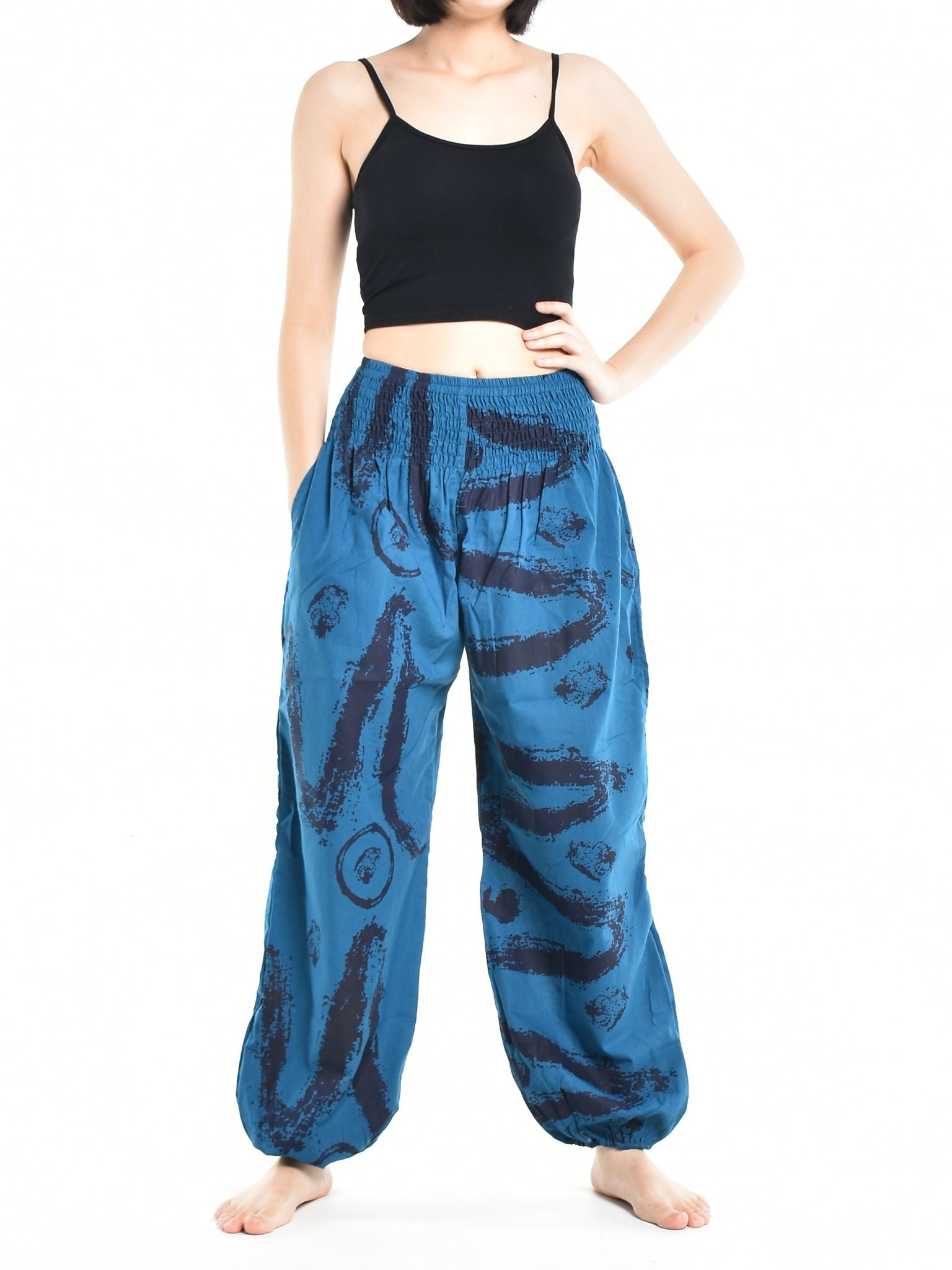 Bohotusk Women's Autumn Blue Swirl Cotton Harem Pants displayed on a model, showcasing the elasticated waist and vibrant print.