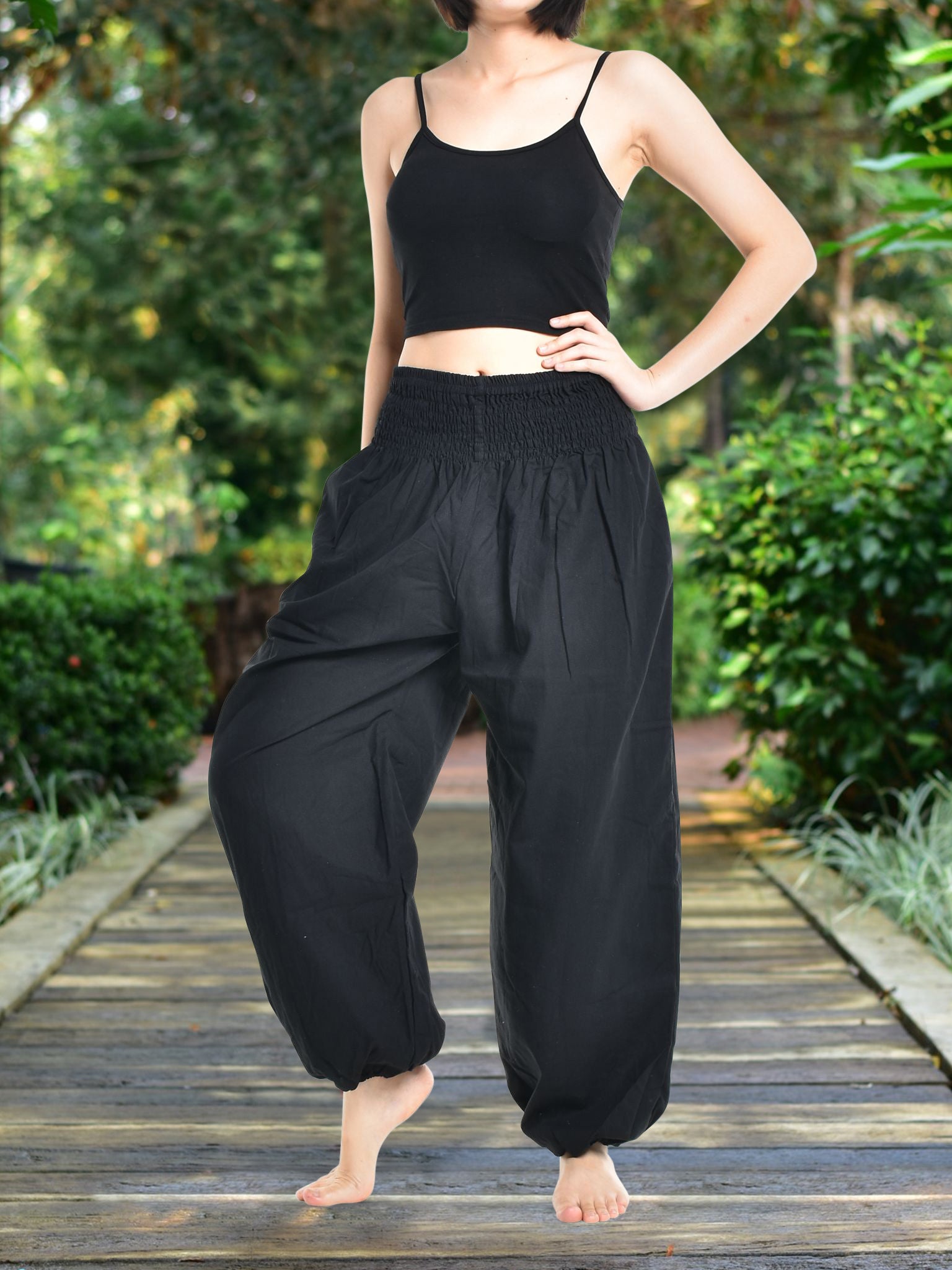 Bohotusk Women's Autumn Plain Black Cotton Harem Pants displayed on a model, showcasing the elasticated waist and ankle design.