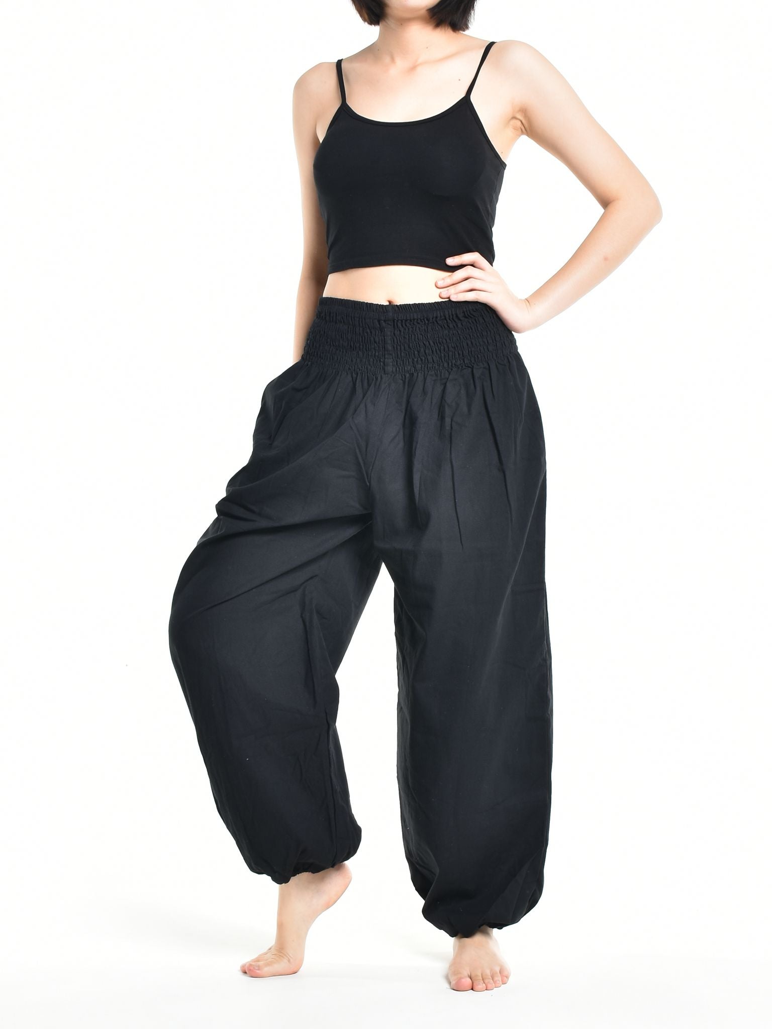 Bohotusk Women's Autumn Plain Black Cotton Harem Pants displayed on a model, showcasing the elasticated waist and ankle design.