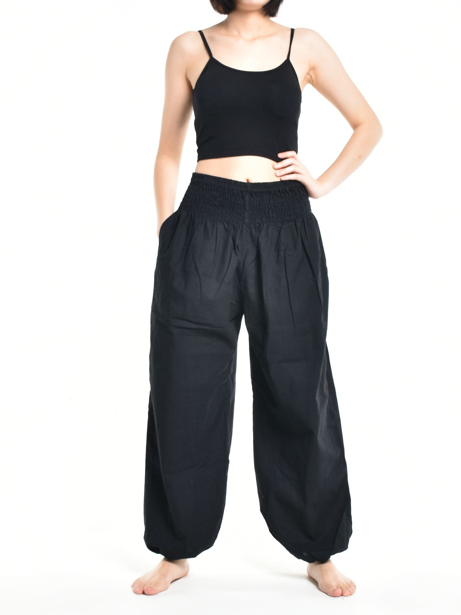 Bohotusk Women's Autumn Plain Black Cotton Harem Pants displayed on a model, showcasing the elasticated waist and ankle design.