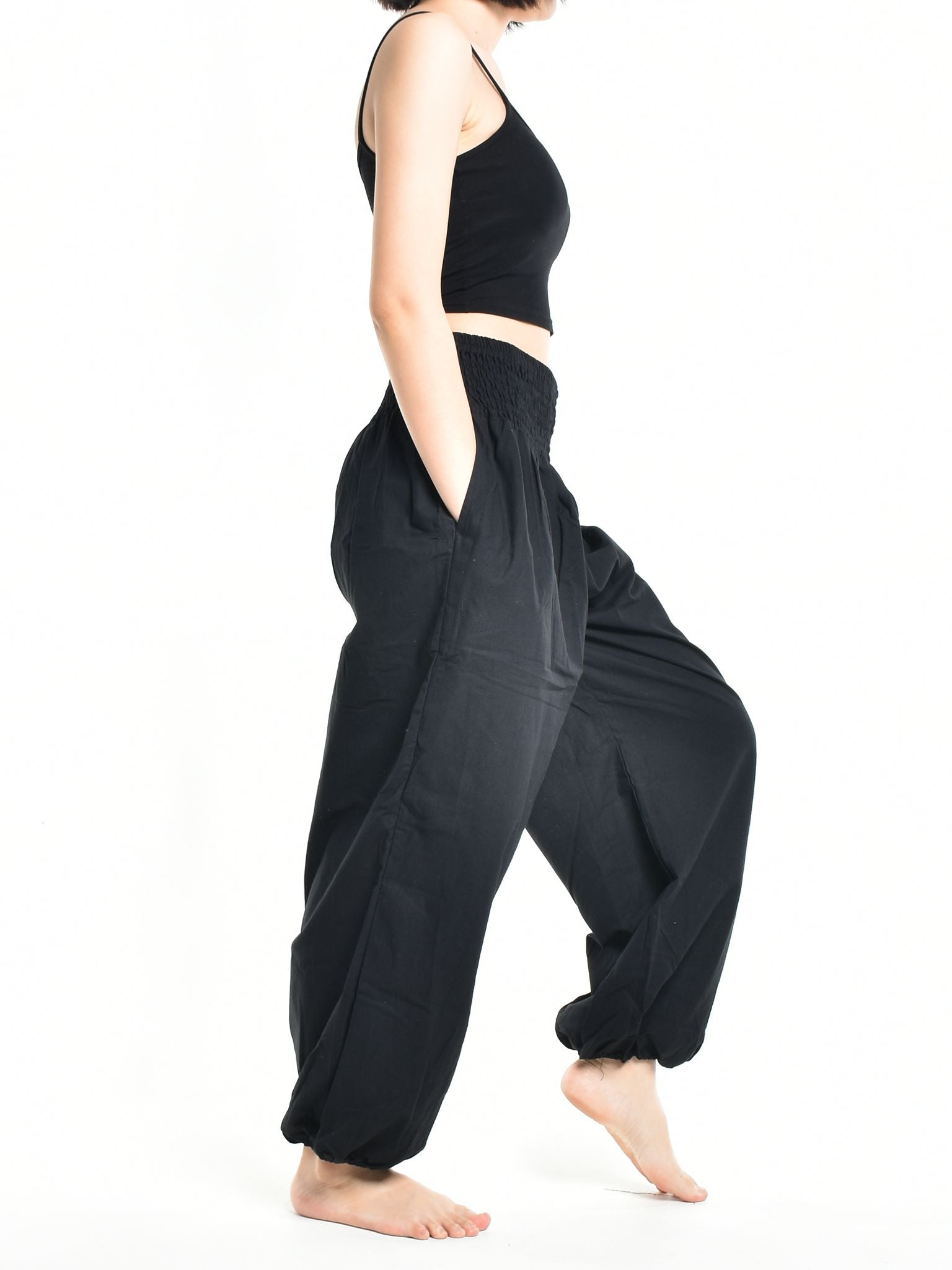 Bohotusk Women's Autumn Plain Black Cotton Harem Pants displayed on a model, showcasing the elasticated waist and ankle design.