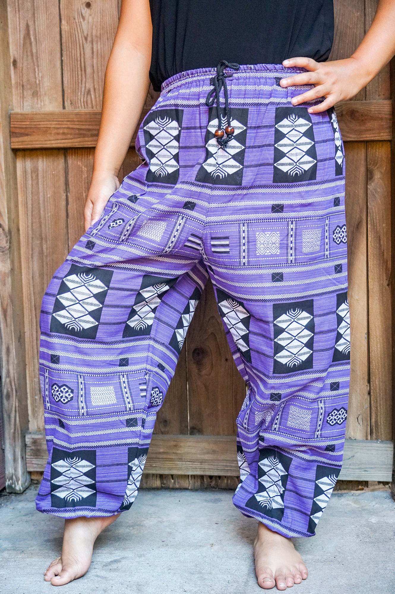 A pair of stylish Cotton Women Tribal Boho Pants featuring a soft cotton fabric, elastic drawstring waist, and boho rims at the hips, perfect for casual wear.